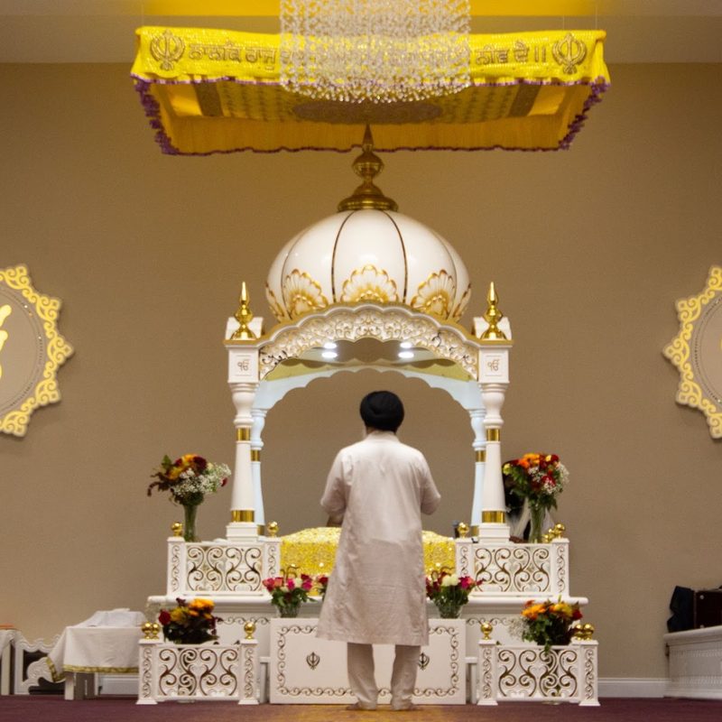 The Palki Sahib in the Darbar Hall, beneath the chandelier