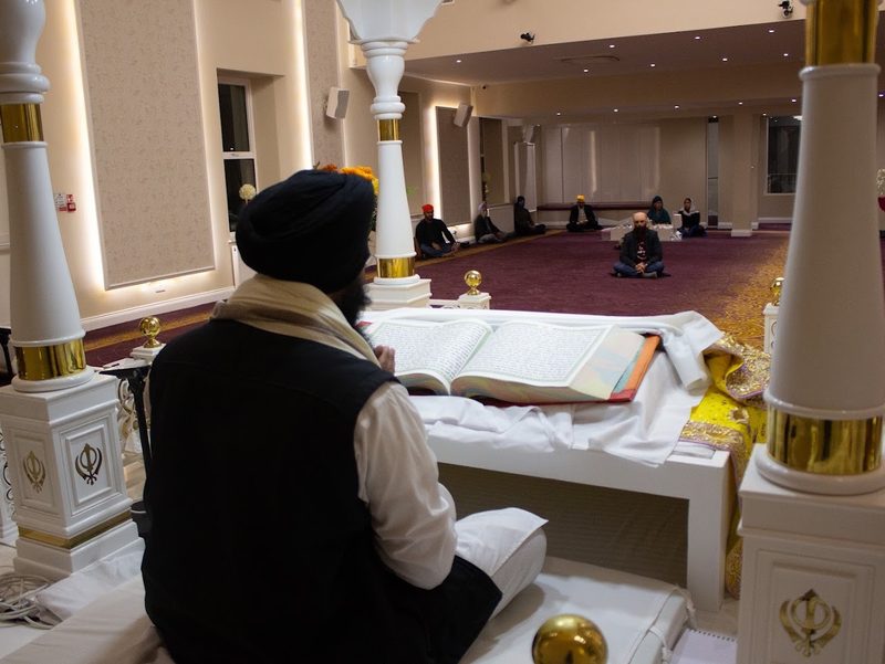 Reading from Sri Guru Granth Sahib Ji in the Darbar Hall